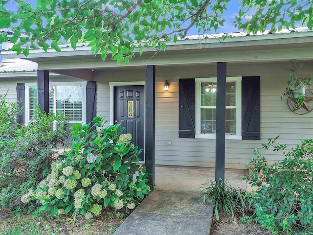 3738 Fm 161 S, Hughes Springs, TX 75656 - doorway to property with covered porch