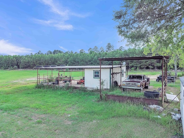 3738 Fm 161 S, Hughes Springs, TX 75656 - view of green lawn with a carport