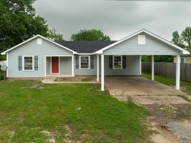 ranch-style home featuring a front yard and a carport