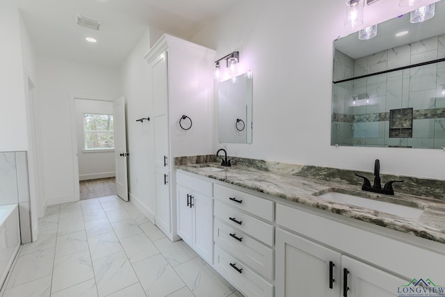 bathroom featuring vanity and walk in shower