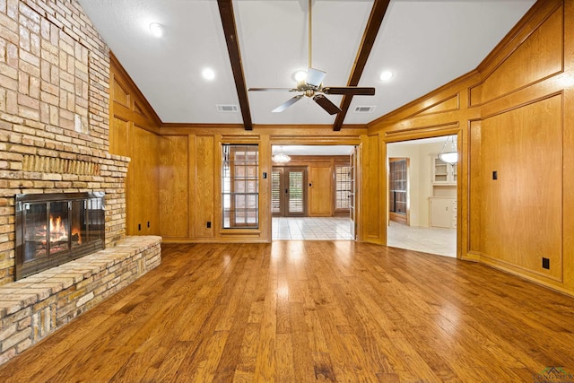 1 Rim Rd, Kilgore, TX 75662 - unfurnished living room featuring wood finished floors, a fireplace, a ceiling fan, and ornamental molding