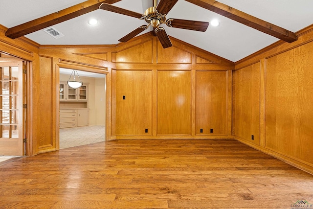 1 Rim Rd, Kilgore, TX 75662 - unfurnished room with a ceiling fan, light wood-style flooring, and wood walls