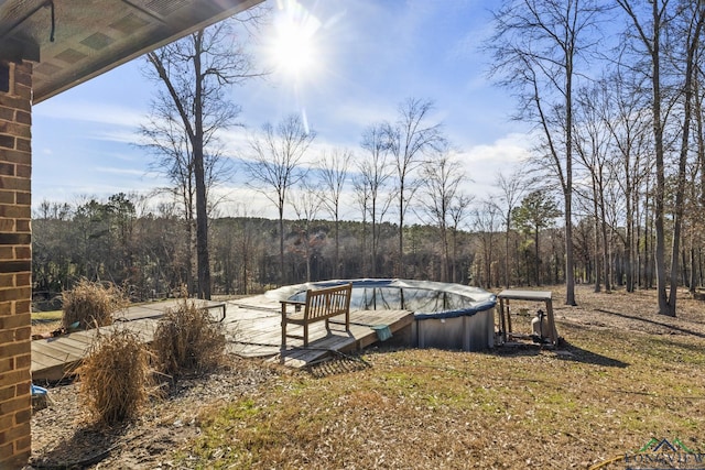 view of yard featuring a covered pool