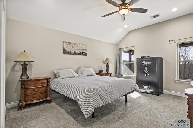 carpeted bedroom with multiple windows, vaulted ceiling, and ceiling fan