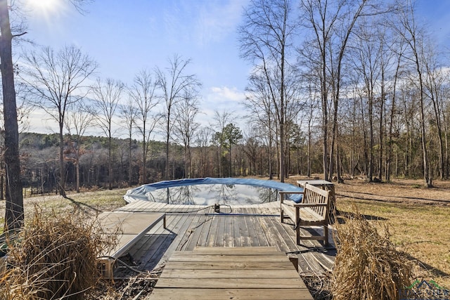 view of pool with a wooden deck