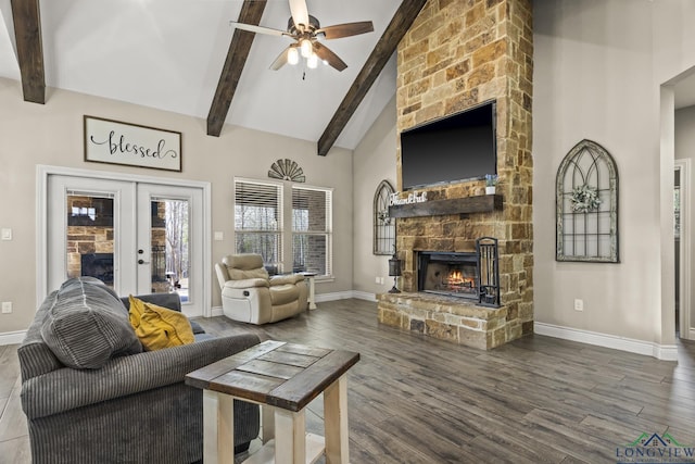 living room with french doors, hardwood / wood-style flooring, ceiling fan, a fireplace, and beamed ceiling