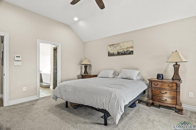 bedroom with light carpet, vaulted ceiling, ensuite bath, and ceiling fan