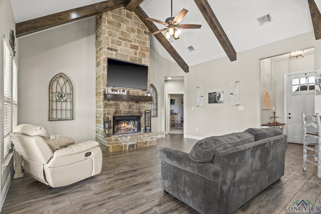 living room with ceiling fan, a fireplace, high vaulted ceiling, and beamed ceiling