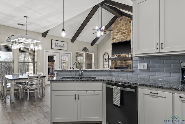 kitchen with french doors, backsplash, pendant lighting, dishwasher, and white cabinetry