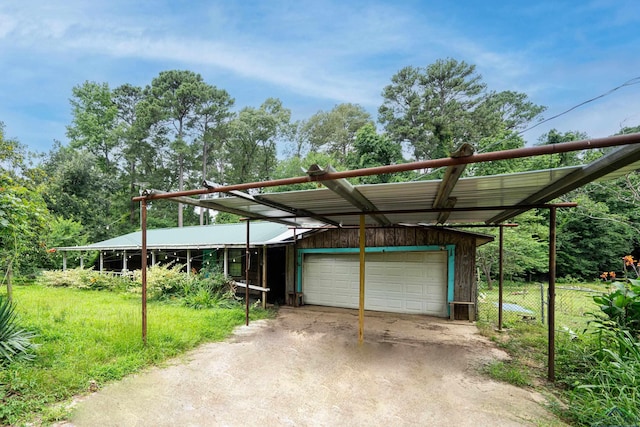 view of parking featuring a garage and a carport