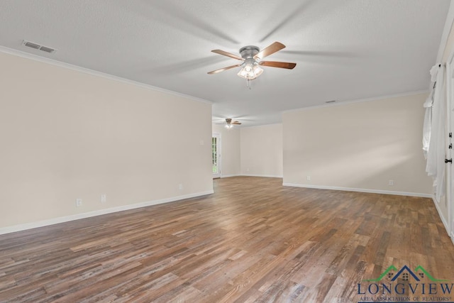 11562 19th Ave, Tyler, TX 75709 - unfurnished room with a ceiling fan, ornamental molding, wood finished floors, and baseboards