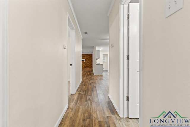 11562 19th Ave, Tyler, TX 75709 - hallway featuring wood finished floors and baseboards