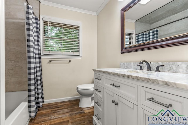 11562 19th Ave, Tyler, TX 75709 - bathroom featuring vanity, wood finished floors, ornamental molding, baseboards, and toilet