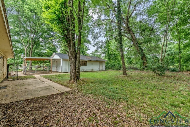 11562 19th Ave, Tyler, TX 75709 - view of yard featuring a carport