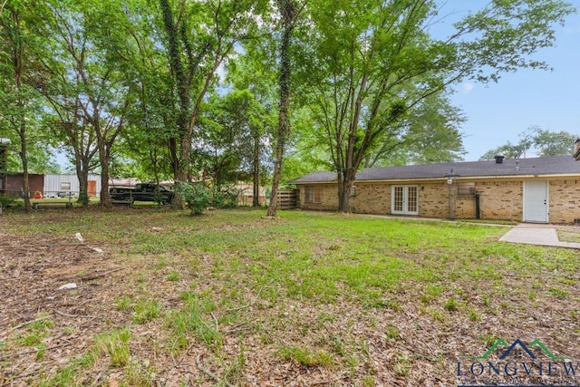 11562 19th Ave, Tyler, TX 75709 - view of yard featuring french doors