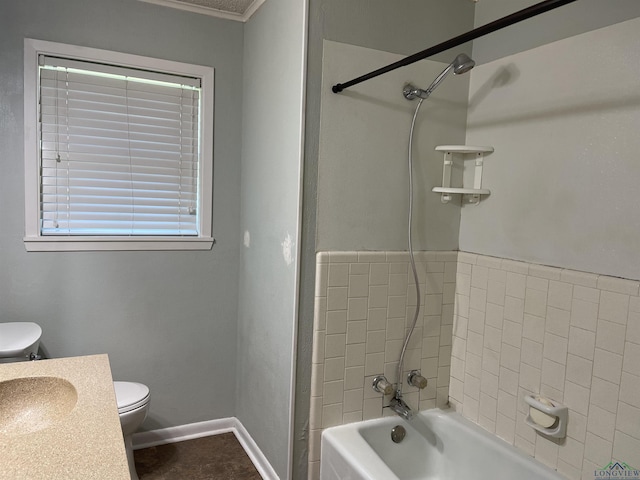 full bath with vanity, toilet, shower / bath combination, and baseboards