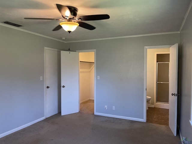 unfurnished bedroom featuring visible vents, baseboards, a closet, and crown molding