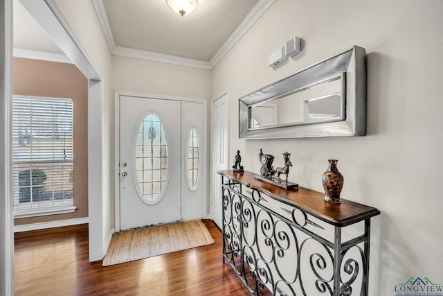 entryway featuring ornamental molding, dark wood-style flooring, and baseboards