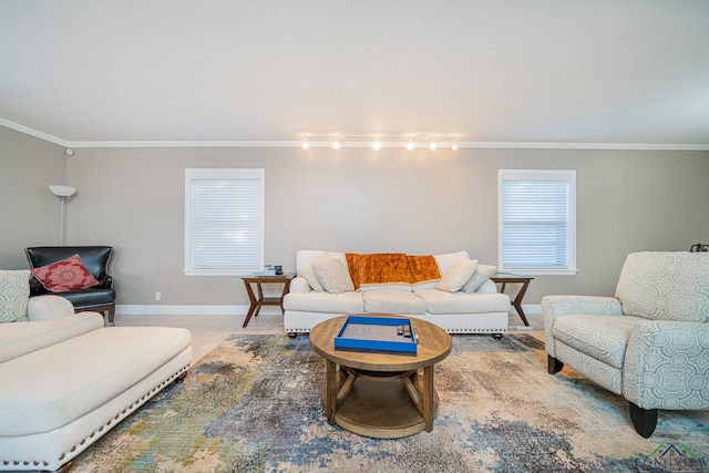 tiled living room with ornamental molding and rail lighting