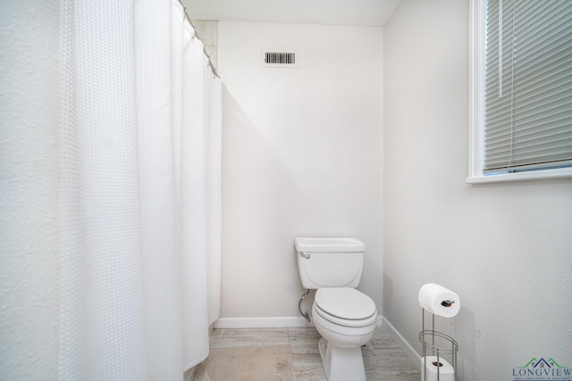 bathroom featuring toilet