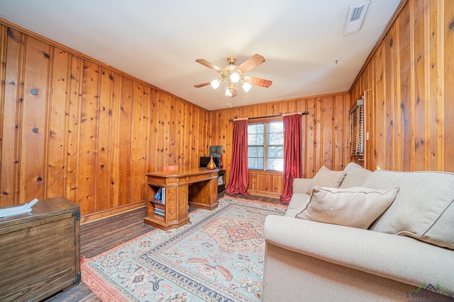 office space with wood-type flooring, ceiling fan, and ornamental molding