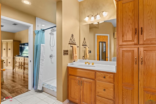 1463 County Road 106, Carthage, TX 75633 - bathroom with a shower stall, vanity, and tile patterned flooring
