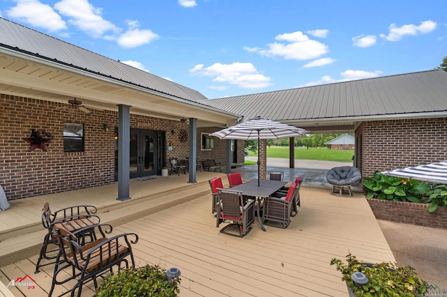 1463 County Road 106, Carthage, TX 75633 - deck with french doors and outdoor dining area