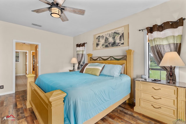 1463 County Road 106, Carthage, TX 75633 - bedroom featuring dark wood-style flooring and ceiling fan