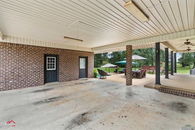 1463 County Road 106, Carthage, TX 75633 - view of patio featuring a ceiling fan and outdoor dining space
