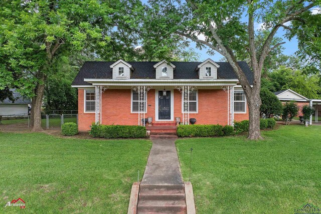 1204 Collins St, Henderson, TX 75654 - view of front of house with brick siding and a shingled roof