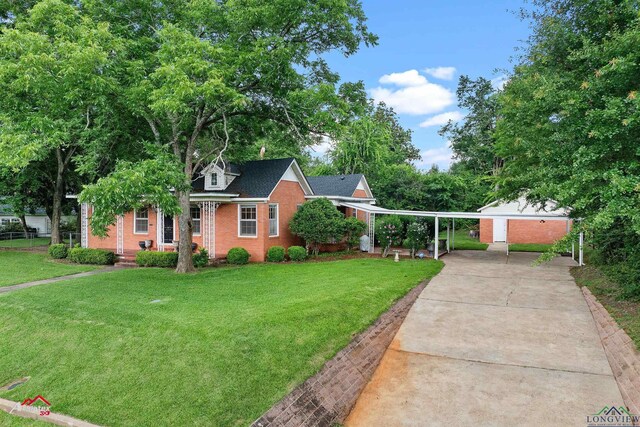 1204 Collins St, Henderson, TX 75654 - view of front of property featuring brick siding, concrete driveway, a front yard, and a porch