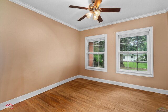 1204 Collins St, Henderson, TX 75654 - empty room with ornamental molding, baseboards, wood finished floors, and a ceiling fan
