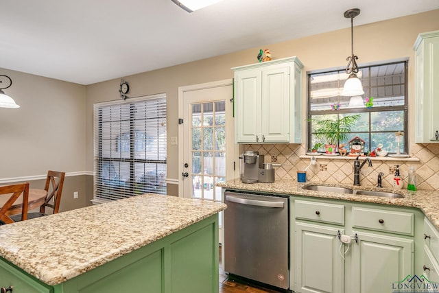 kitchen with dishwasher, sink, tasteful backsplash, pendant lighting, and green cabinetry