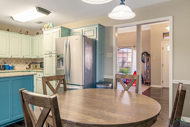 dining room with dark hardwood / wood-style floors