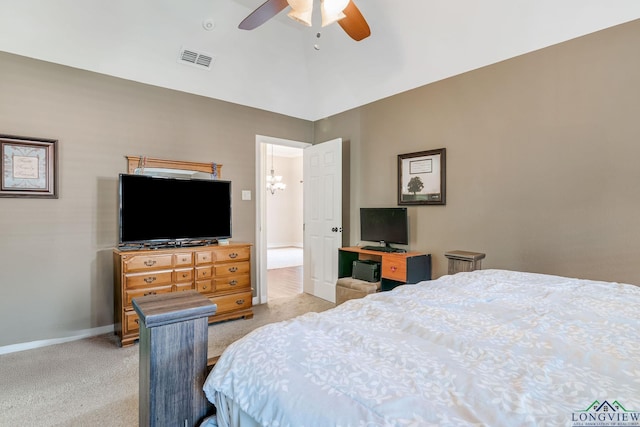 bedroom featuring ceiling fan with notable chandelier and light carpet