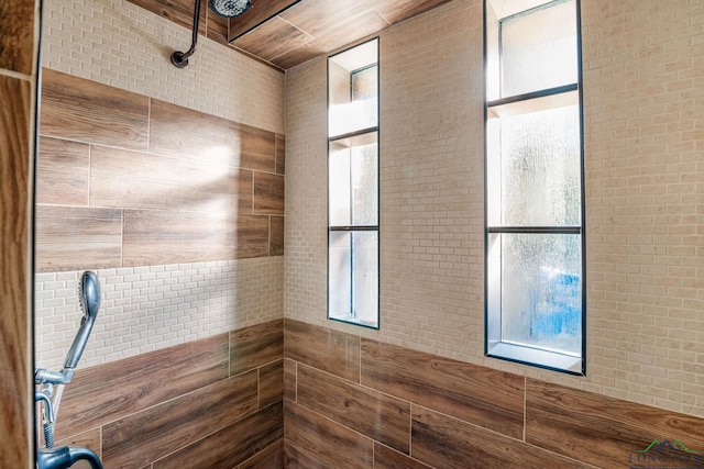 bathroom with tiled shower