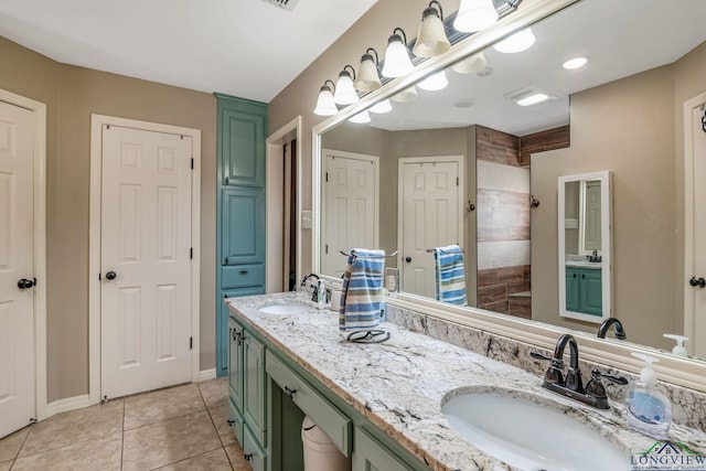 bathroom with tile patterned flooring and vanity