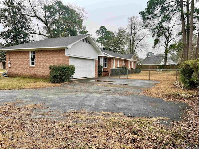 view of property exterior with a garage