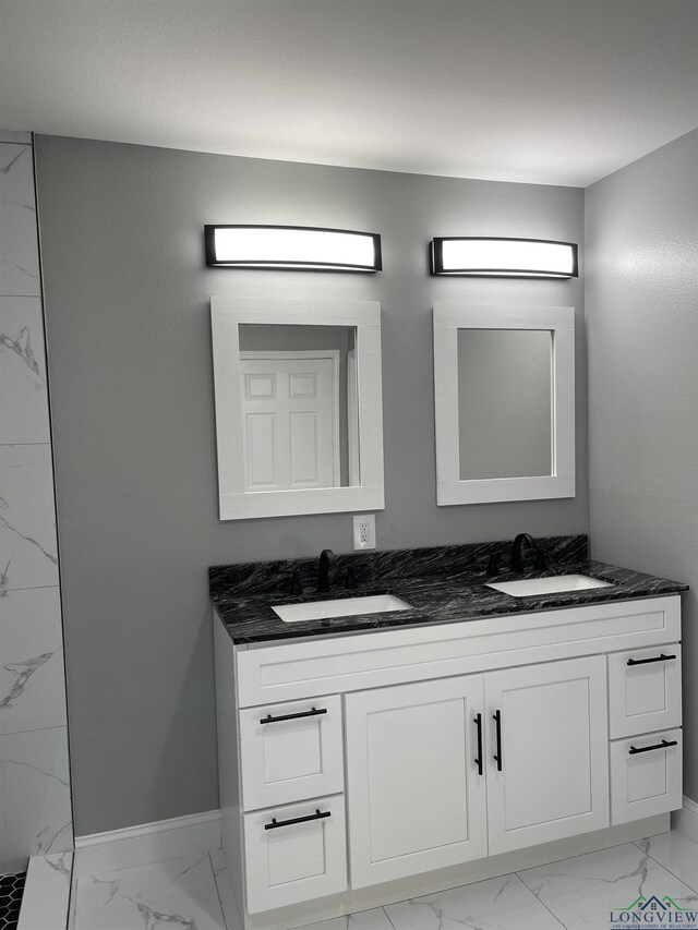 220 Myrle Ave, Longview, TX 75602 - bathroom featuring marble finish floors and double vanity