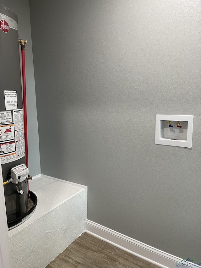 220 Myrle Ave, Longview, TX 75602 - laundry area featuring water heater, wood finished floors, and hookup for a washing machine