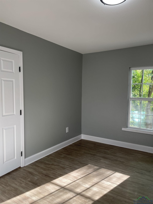 220 Myrle Ave, Longview, TX 75602 - spare room featuring dark wood finished floors