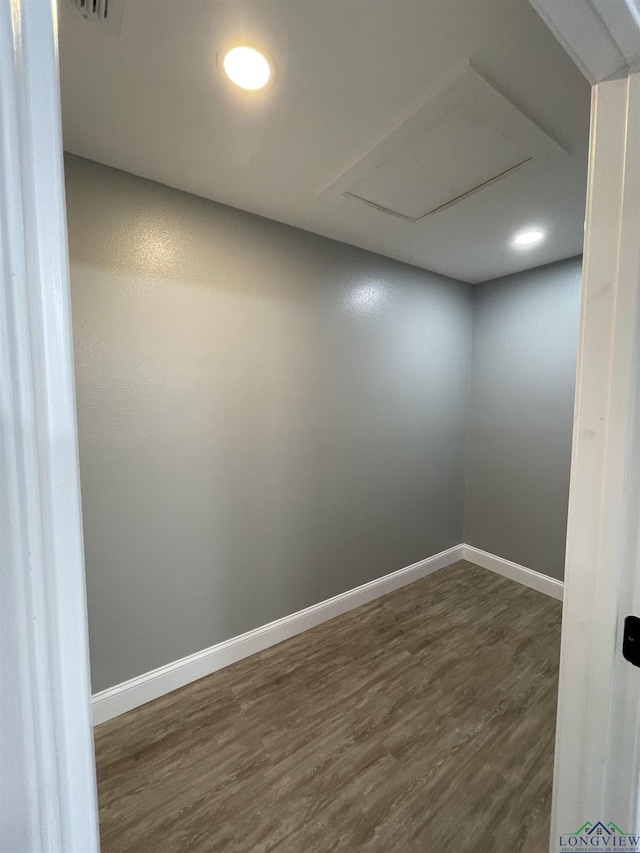220 Myrle Ave, Longview, TX 75602 - empty room with dark wood-style flooring, attic access, and recessed lighting