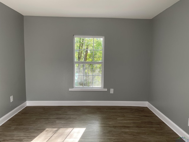 220 Myrle Ave, Longview, TX 75602 - empty room with dark wood finished floors