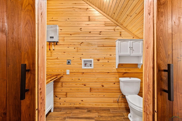 bathroom featuring hardwood / wood-style flooring and toilet