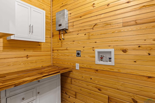 clothes washing area featuring cabinets, washer hookup, and electric dryer hookup