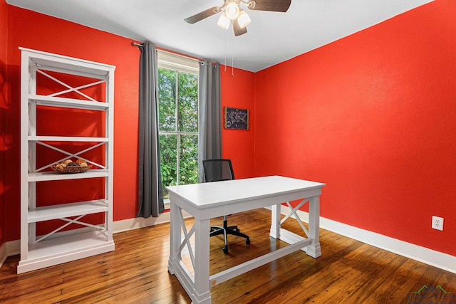 office featuring baseboards, ceiling fan, and hardwood / wood-style flooring