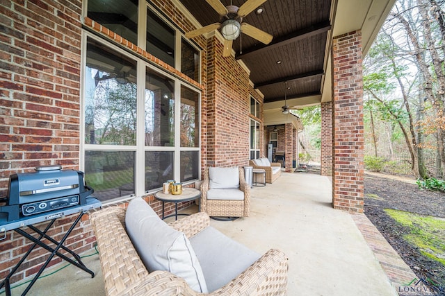 view of patio featuring a grill and ceiling fan