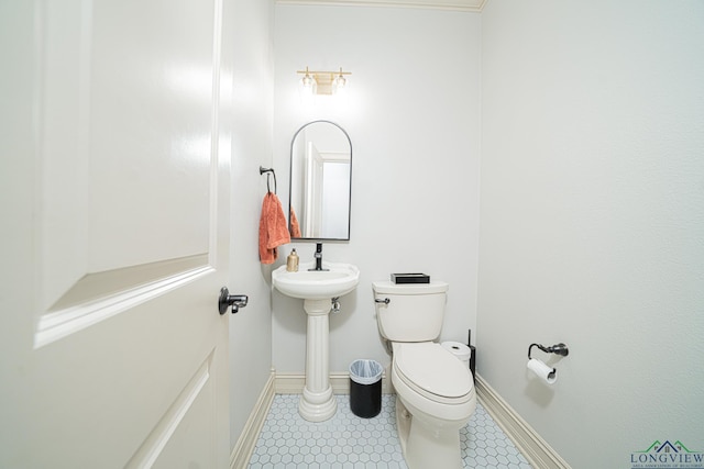 bathroom with tile patterned floors and toilet