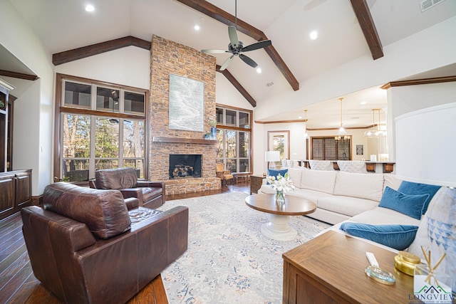 living room with a fireplace, dark hardwood / wood-style flooring, high vaulted ceiling, and beam ceiling