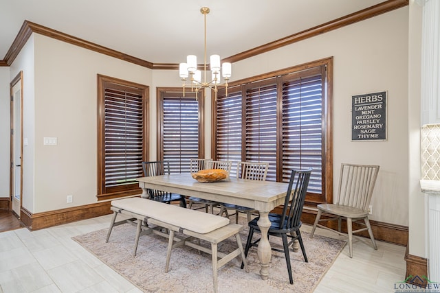 dining area featuring ornamental molding and a chandelier